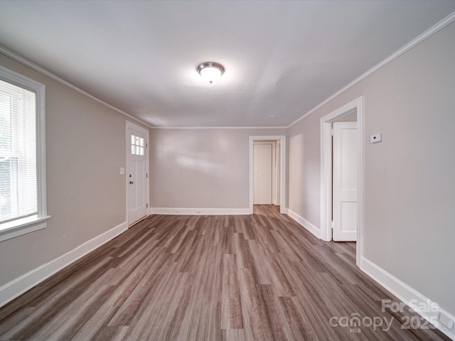 121 Patrick St, Gastonia, NC 28054 - empty room with wood finished floors, plenty of natural light, crown molding, and baseboards
