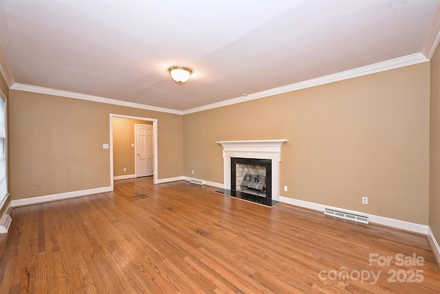 1961 Runnymede Ln, Charlotte, NC 28211 - unfurnished living room featuring ornamental molding, a fireplace, wood finished floors, and baseboards
