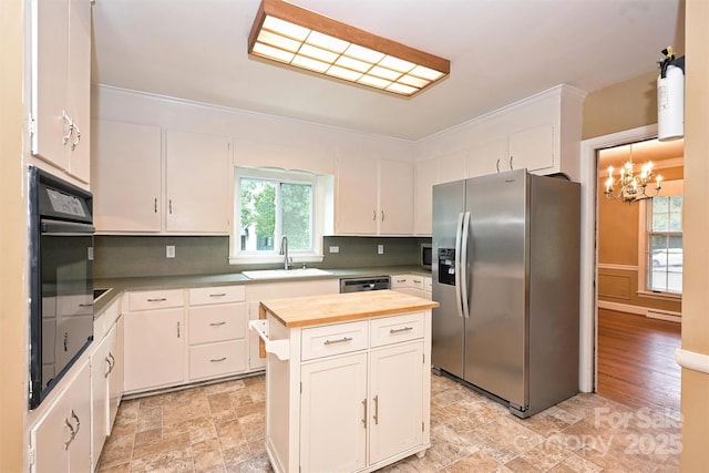 1961 Runnymede Ln, Charlotte, NC 28211 - kitchen with appliances with stainless steel finishes, wood counters, a sink, decorative backsplash, and white cabinetry