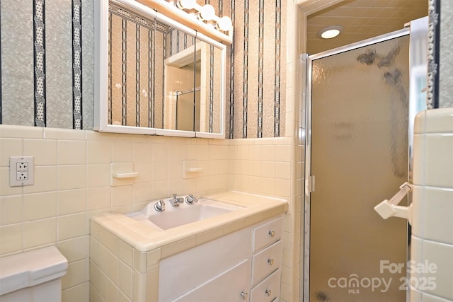 1961 Runnymede Ln, Charlotte, NC 28211 - full bath with a stall shower, vanity, toilet, decorative backsplash, and tile walls