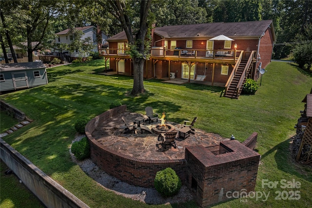 2010 Dogwood Trl, Shelby, NC 28150 - view of grassy yard with an outdoor fire pit, stairs, a deck, and a patio