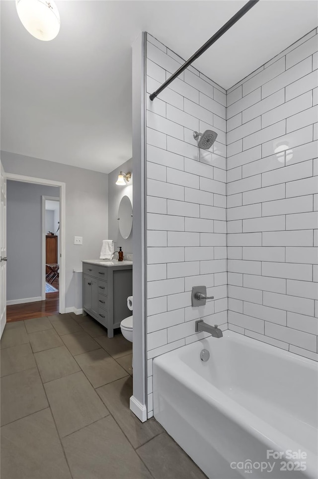 2010 Dogwood Trl, Shelby, NC 28150 - bathroom featuring tile patterned flooring, vanity, shower / washtub combination, toilet, and baseboards
