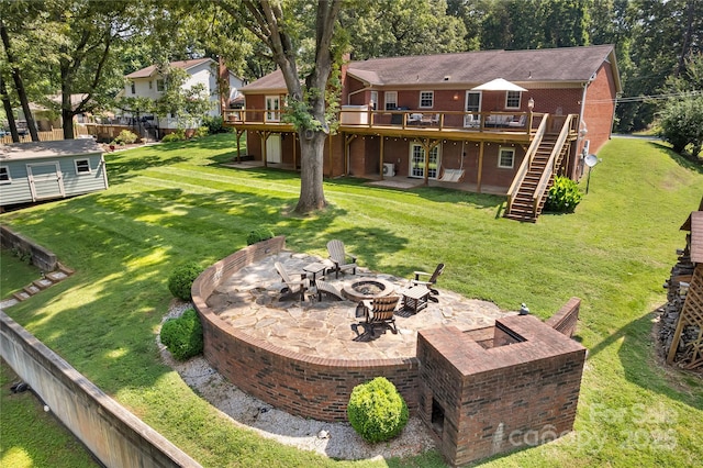 2010 Dogwood Trl, Shelby, NC 28150 - back of property featuring an outdoor fire pit, stairs, a wooden deck, and a yard