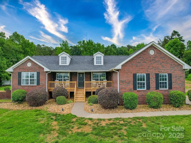 1060 S Lentz Harness Shop Rd, Mount Pleasant, NC 28124 - view of front of property with brick siding, a front lawn, a shingled roof, and covered porch