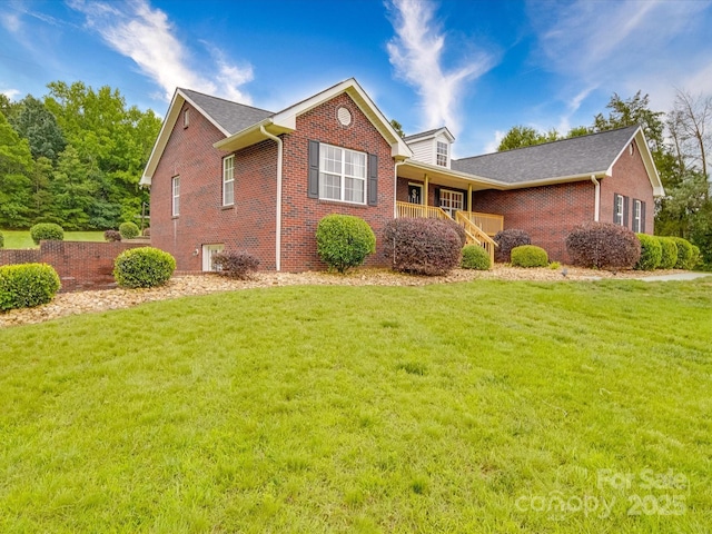 1060 S Lentz Harness Shop Rd, Mount Pleasant, NC 28124 - view of front of property with brick siding and a front lawn