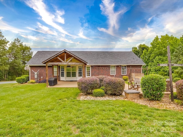 1060 S Lentz Harness Shop Rd, Mount Pleasant, NC 28124 - rear view of house with a patio area, ceiling fan, a lawn, brick siding, and a shingled roof