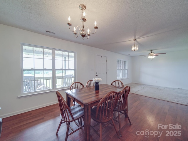 1060 S Lentz Harness Shop Rd, Mount Pleasant, NC 28124 - dining room with a chandelier, a textured ceiling, wood finished floors, ceiling fan, and baseboards