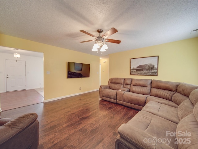 1060 S Lentz Harness Shop Rd, Mount Pleasant, NC 28124 - living room featuring wood finished floors, baseboards, a ceiling fan, and a textured ceiling