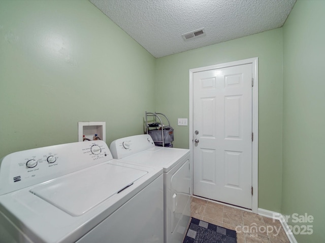 1060 S Lentz Harness Shop Rd, Mount Pleasant, NC 28124 - laundry area featuring washing machine and clothes dryer, baseboards, and a textured ceiling
