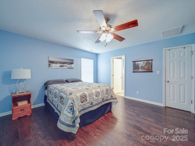 1060 S Lentz Harness Shop Rd, Mount Pleasant, NC 28124 - bedroom with wood finished floors, a textured ceiling, baseboards, and a ceiling fan