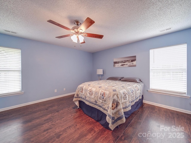 1060 S Lentz Harness Shop Rd, Mount Pleasant, NC 28124 - bedroom with wood finished floors, a textured ceiling, a ceiling fan, and baseboards