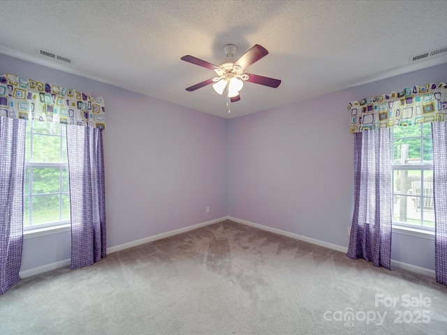 1060 S Lentz Harness Shop Rd, Mount Pleasant, NC 28124 - spare room with carpet floors, a ceiling fan, baseboards, and a textured ceiling