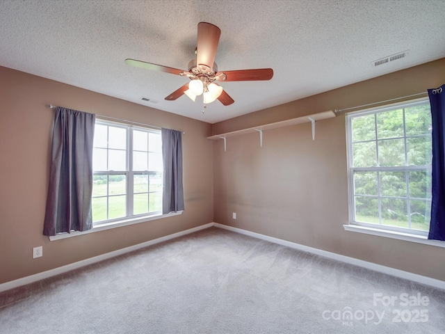 1060 S Lentz Harness Shop Rd, Mount Pleasant, NC 28124 - carpeted spare room featuring baseboards, a ceiling fan, and a textured ceiling