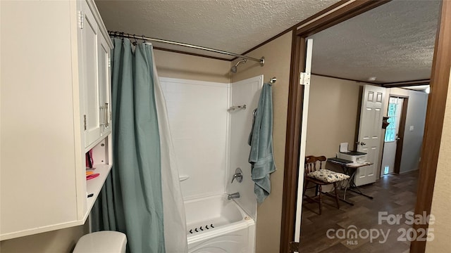 143 Hamilton Rd, Rutherfordton, NC 28139 - bathroom featuring a textured ceiling, shower / tub combo with curtain, wood finished floors, and toilet