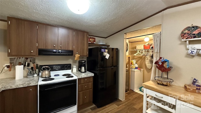143 Hamilton Rd, Rutherfordton, NC 28139 - kitchen with electric range, freestanding refrigerator, range hood, wood finished floors, and light countertops