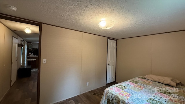 143 Hamilton Rd, Rutherfordton, NC 28139 - bedroom with dark wood-style flooring and a textured ceiling