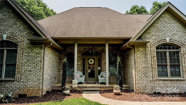 3273 16th St NE, Hickory, NC 28601 - property entrance with covered porch, crawl space, a shingled roof, and brick siding
