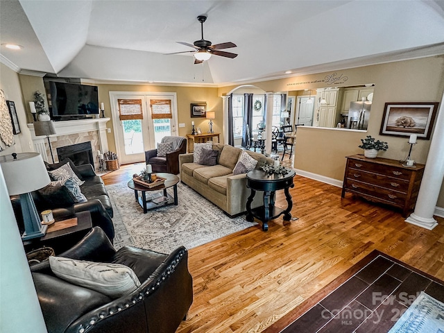 3273 16th St NE, Hickory, NC 28601 - living room with ornamental molding, a ceiling fan, a fireplace, lofted ceiling, and wood finished floors