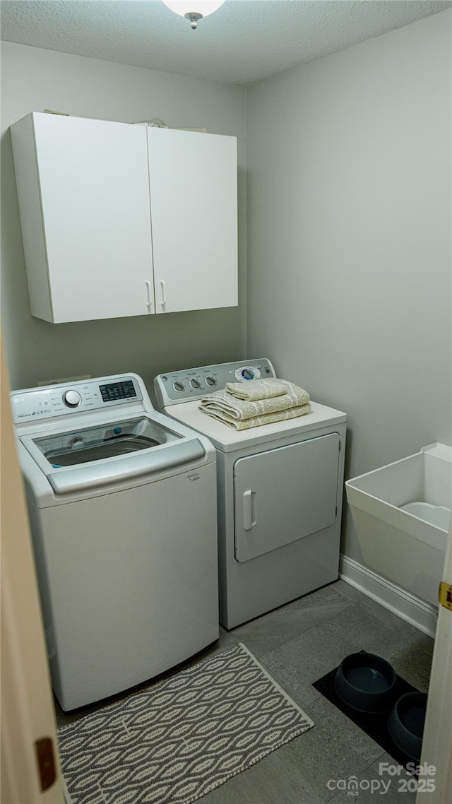 3273 16th St NE, Hickory, NC 28601 - washroom with washing machine and clothes dryer and cabinet space