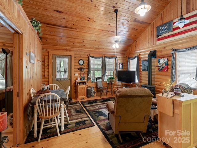 125 Cypress Ln, Saluda, NC 28773 - living area featuring rustic walls, vaulted ceiling, wood ceiling, hardwood / wood-style floors, and plenty of natural light