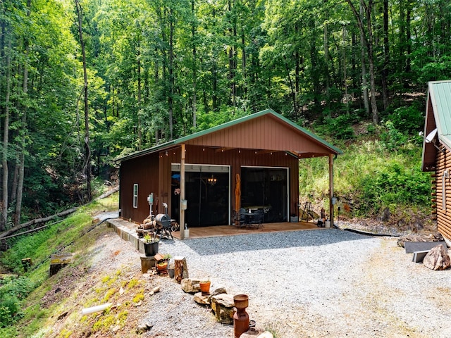 125 Cypress Ln, Saluda, NC 28773 - detached garage featuring a view of trees