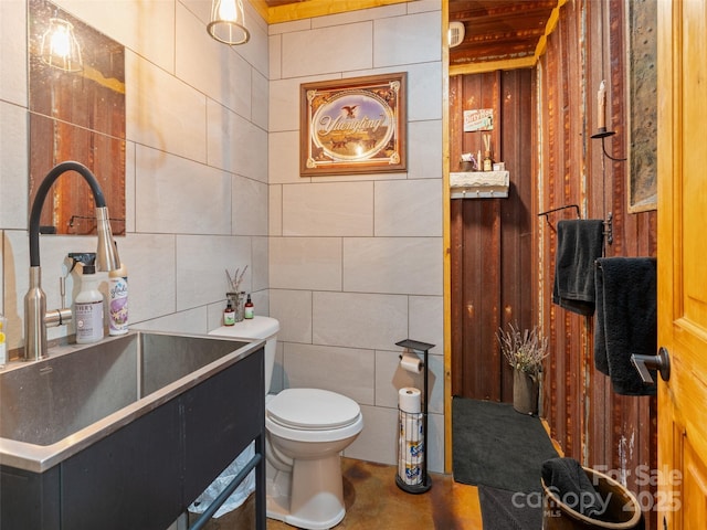 125 Cypress Ln, Saluda, NC 28773 - bathroom featuring a sink, toilet, and tile walls