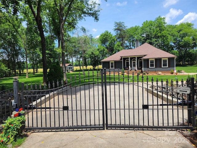 2777 Old S Ct NW, Concord, NC 28027 - gate featuring a fenced front yard and view of scattered trees