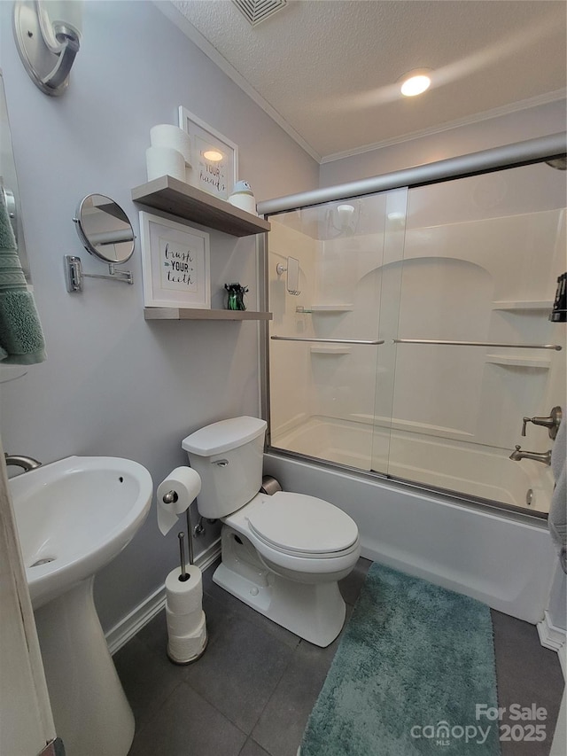 2777 Old S Ct NW, Concord, NC 28027 - bathroom with a textured ceiling, shower / bath combination with glass door, crown molding, and tile patterned floors