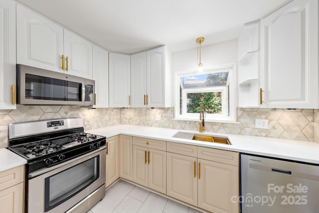 4913 Seacroft Rd, Charlotte, NC 28210 - kitchen with appliances with stainless steel finishes, backsplash, and light countertops