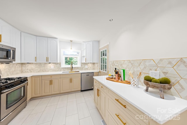 4913 Seacroft Rd, Charlotte, NC 28210 - kitchen featuring appliances with stainless steel finishes, light countertops, and tasteful backsplash