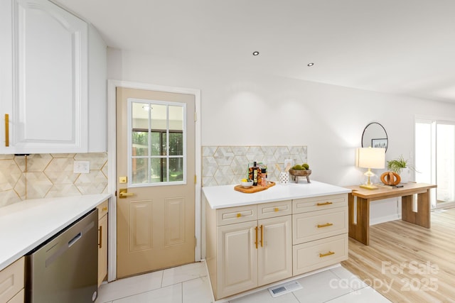 4913 Seacroft Rd, Charlotte, NC 28210 - kitchen with stainless steel dishwasher, healthy amount of natural light, light countertops, and decorative backsplash