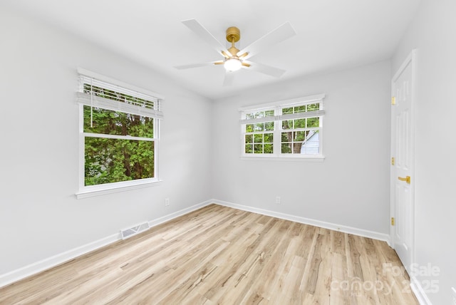 4913 Seacroft Rd, Charlotte, NC 28210 - empty room featuring light wood-style flooring and ceiling fan
