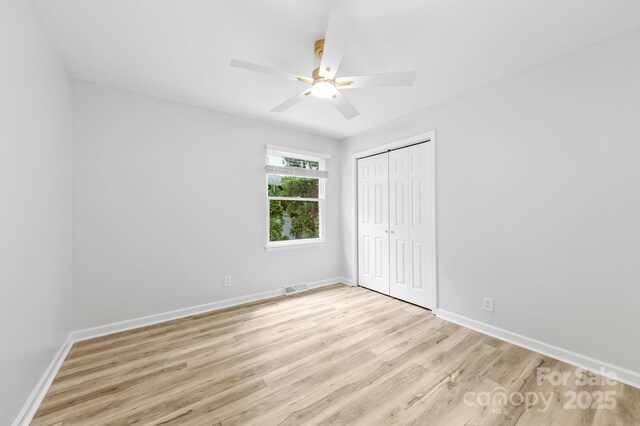 4913 Seacroft Rd, Charlotte, NC 28210 - unfurnished bedroom featuring light wood finished floors, a closet, and ceiling fan