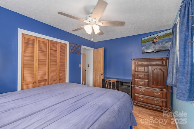 310 Yarbro Rd, Kings Mountain, NC 28086 - bedroom with a closet, wood finished floors, a textured ceiling, and a ceiling fan