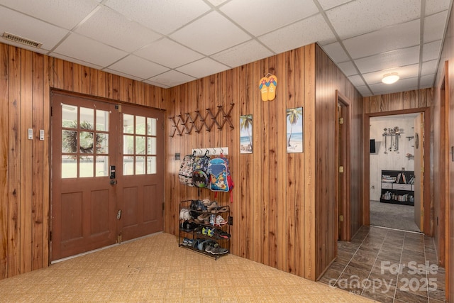 310 Yarbro Rd, Kings Mountain, NC 28086 - foyer entrance with carpet floors, wood walls, and a paneled ceiling