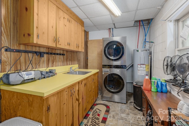 310 Yarbro Rd, Kings Mountain, NC 28086 - laundry area with stacked washer / dryer, electric water heater, and cabinet space