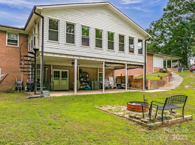 310 Yarbro Rd, Kings Mountain, NC 28086 - back of property with stairway, a fire pit, a ceiling fan, and a yard