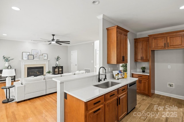 11139 Tradition View Dr, Charlotte, NC 28269 - kitchen with dishwasher, a sink, light wood-style floors, light countertops, and a ceiling fan