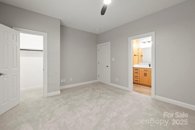 11139 Tradition View Dr, Charlotte, NC 28269 - unfurnished bedroom with light carpet, a spacious closet, baseboards, ensuite bath, and a closet