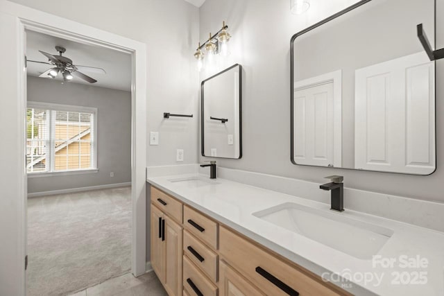 11139 Tradition View Dr, Charlotte, NC 28269 - bathroom with double vanity, a ceiling fan, and baseboards