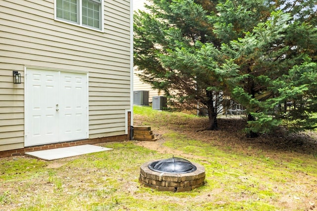 11139 Tradition View Dr, Charlotte, NC 28269 - view of green lawn featuring an outdoor fire pit and cooling unit