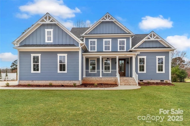332 Canvasback Rd, Mooresville, NC 28117 - craftsman house with board and batten siding, a porch, a front yard, and crawl space