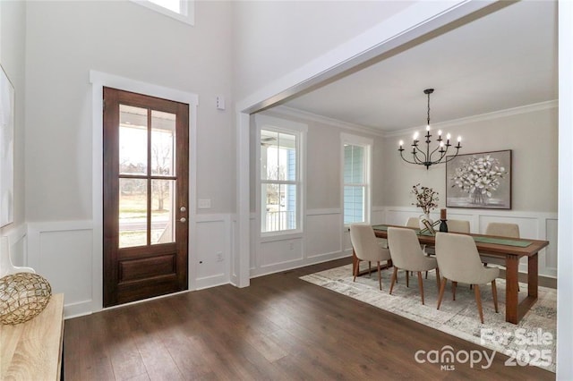 332 Canvasback Rd, Mooresville, NC 28117 - entryway with a decorative wall, plenty of natural light, wainscoting, wood finished floors, and a chandelier