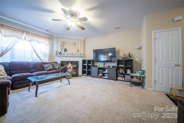 16525 Kettlewell Ln, Charlotte, NC 28277 - carpeted living room with a ceiling fan and a high end fireplace