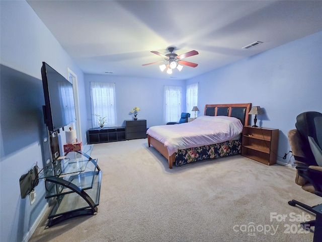 16525 Kettlewell Ln, Charlotte, NC 28277 - carpeted bedroom with multiple windows, a ceiling fan, and baseboards
