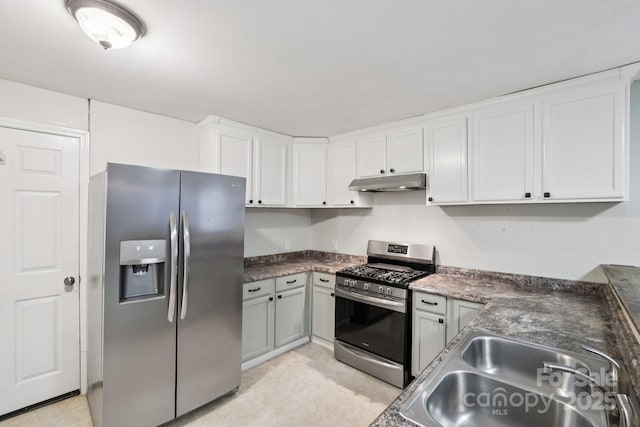 407 Cherry St, Belmont, NC 28012 - kitchen with stainless steel appliances, a sink, under cabinet range hood, dark countertops, and white cabinets