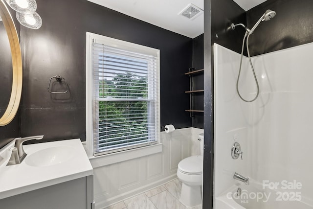 407 Cherry St, Belmont, NC 28012 - bathroom with vanity, toilet, shower / tub combination, and marble finish floors