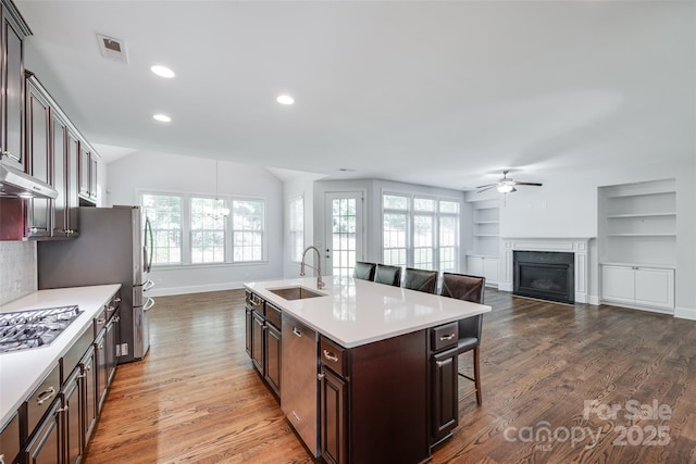 2785 Disney Pl, Indian Land, SC 29707 - kitchen featuring a sink, a ceiling fan, stainless steel appliances, a kitchen breakfast bar, and light countertops