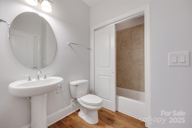 2785 Disney Pl, Indian Land, SC 29707 - bathroom featuring toilet, wood finished floors, shower / bathtub combination, baseboards, and a sink