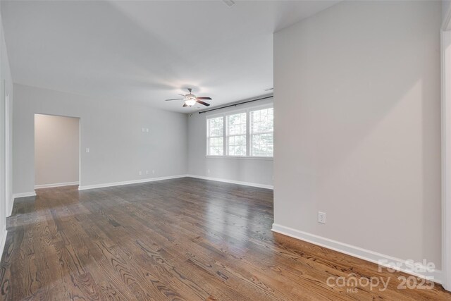 2785 Disney Pl, Indian Land, SC 29707 - empty room featuring a ceiling fan, baseboards, and dark wood-type flooring